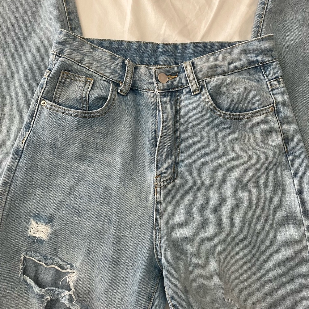 blue ripped jeans